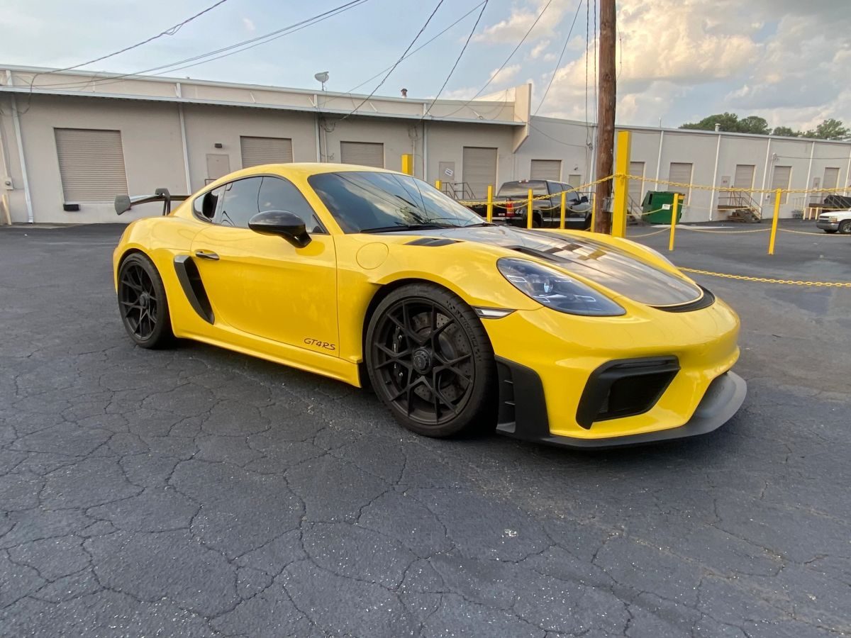 Yellow Porsche GT4 with glossy protected finish
